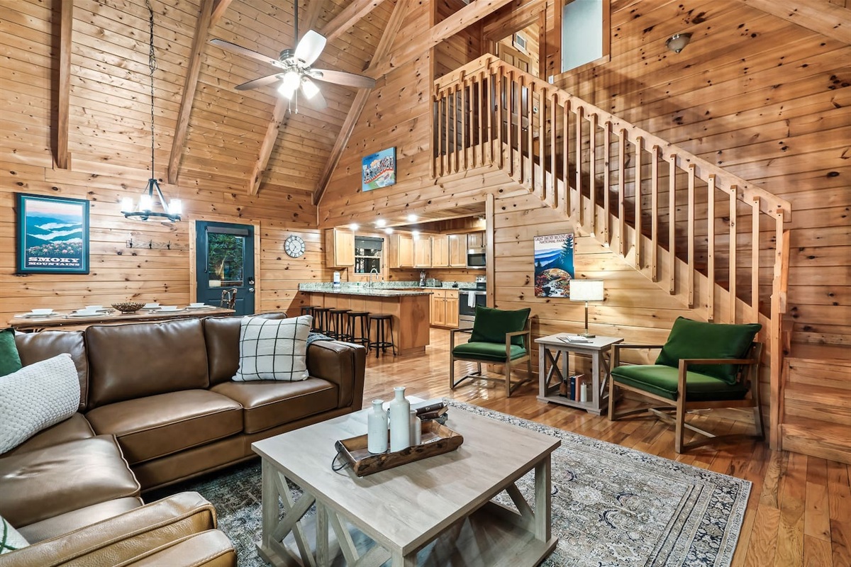 Full View of Open Concept Living, Dining, and Kitchen areas. 
Stairs lead to Spacious Master Suite