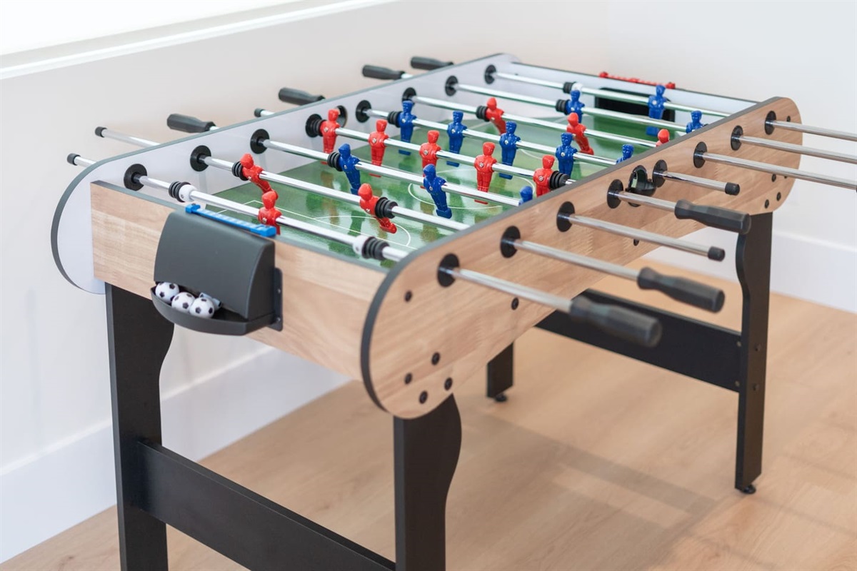 Foosball table brings extra fun and energy to this entertainment-focused loft space.