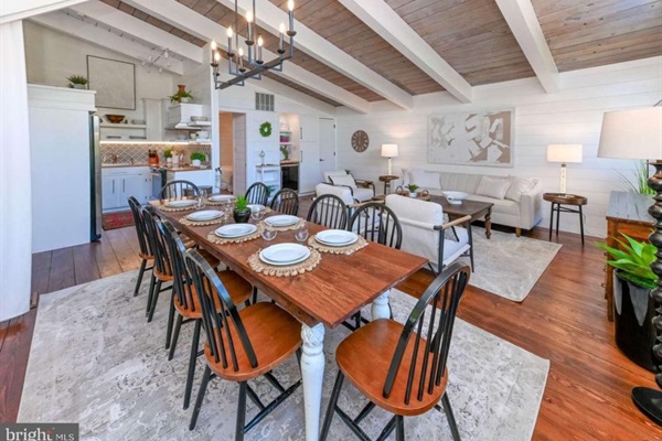 Charming beach cottage with gorgeous wood ceilings and shiplap throughout.