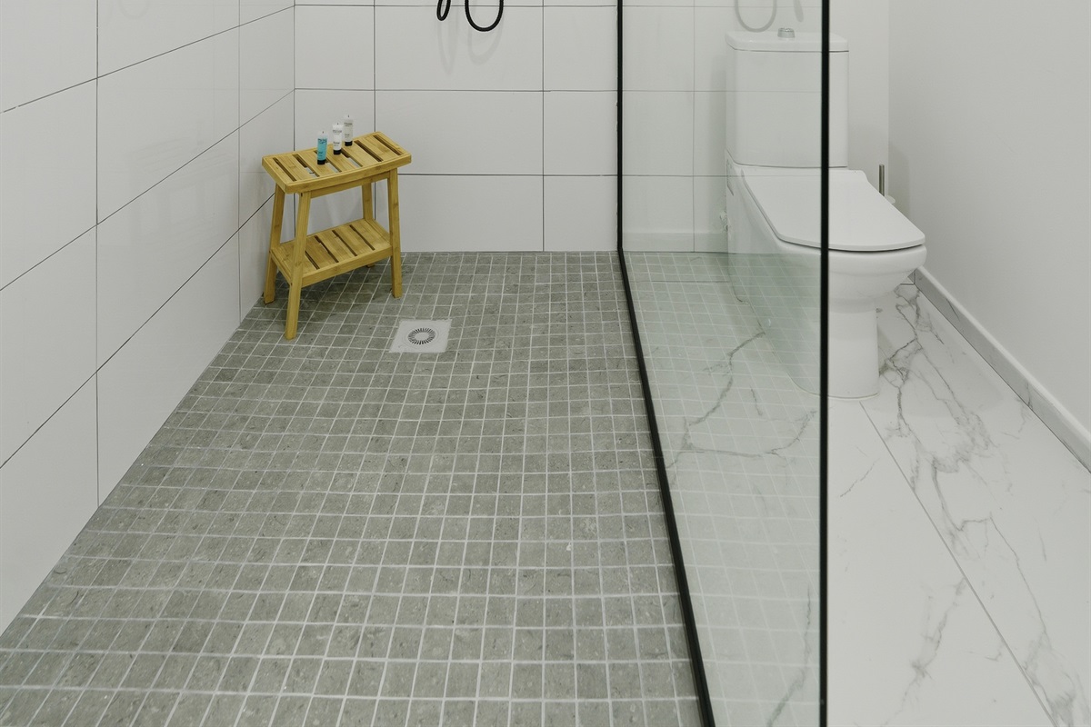 Walk-in shower with sleek glass surround