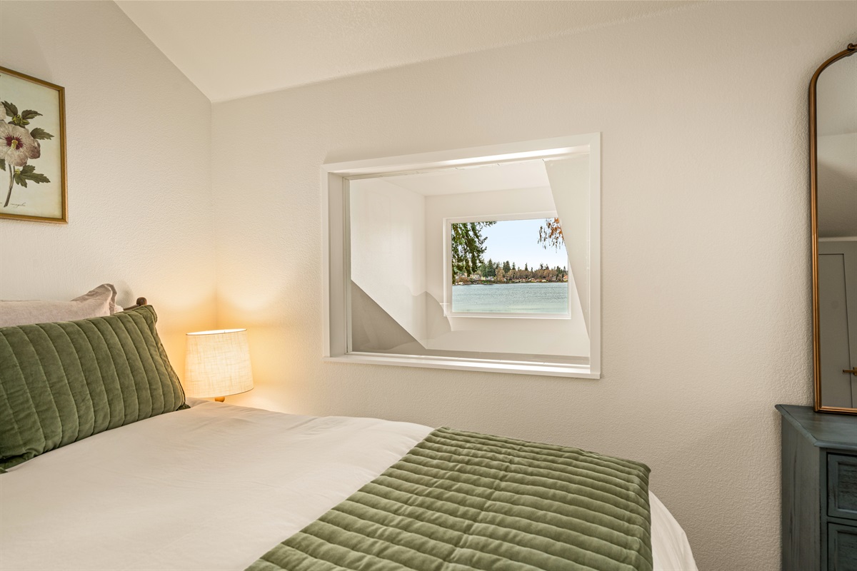 Second bedroom with views of lake, queen bed, premium linens, natural noise machine, own heat and a/c unit!