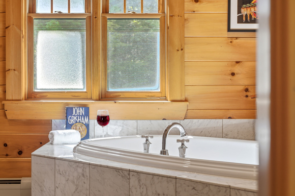 Unwind and recharge with a soothing soak in the oversized whirlpool tub.