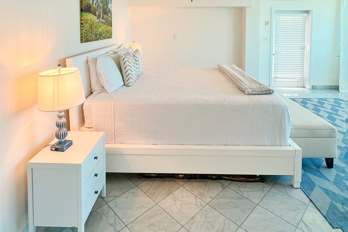 Bedroom provides space and style for a restful vacation.