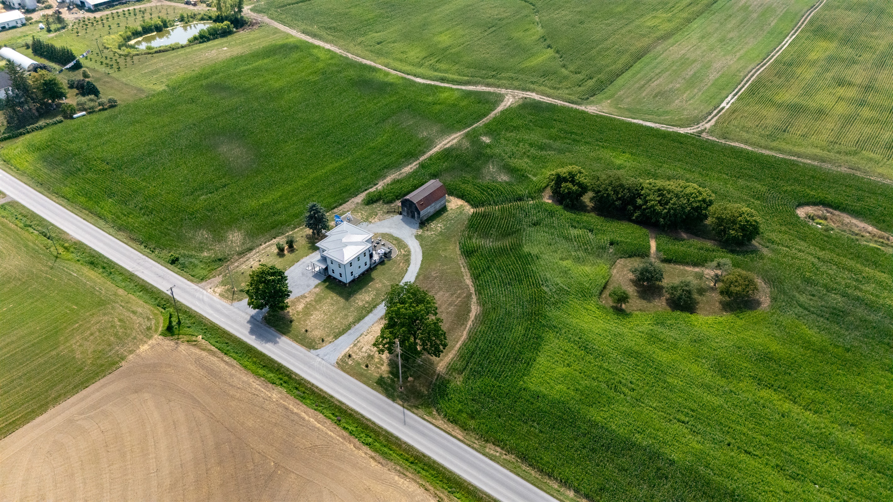 Bird’s-eye view showcasing endless farmland and privacy—ideal for serene country living.