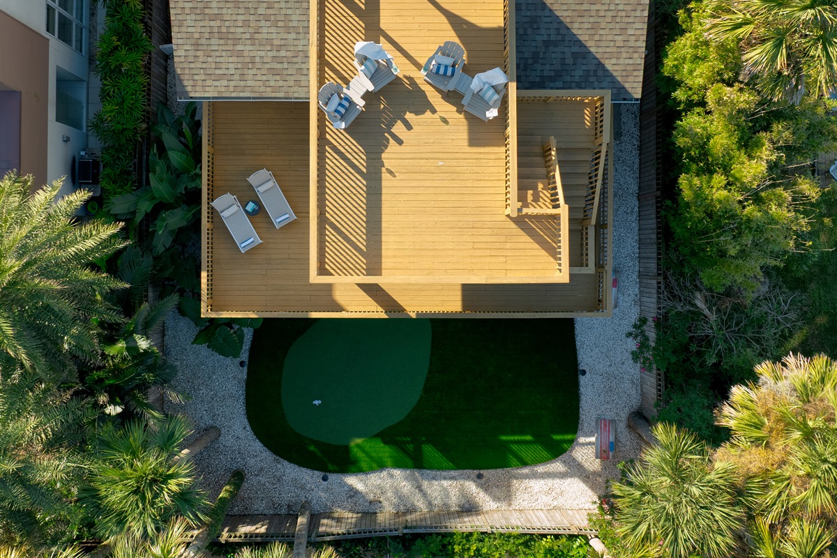 Top-down aerial view highlighting the rooftop deck + private putting green