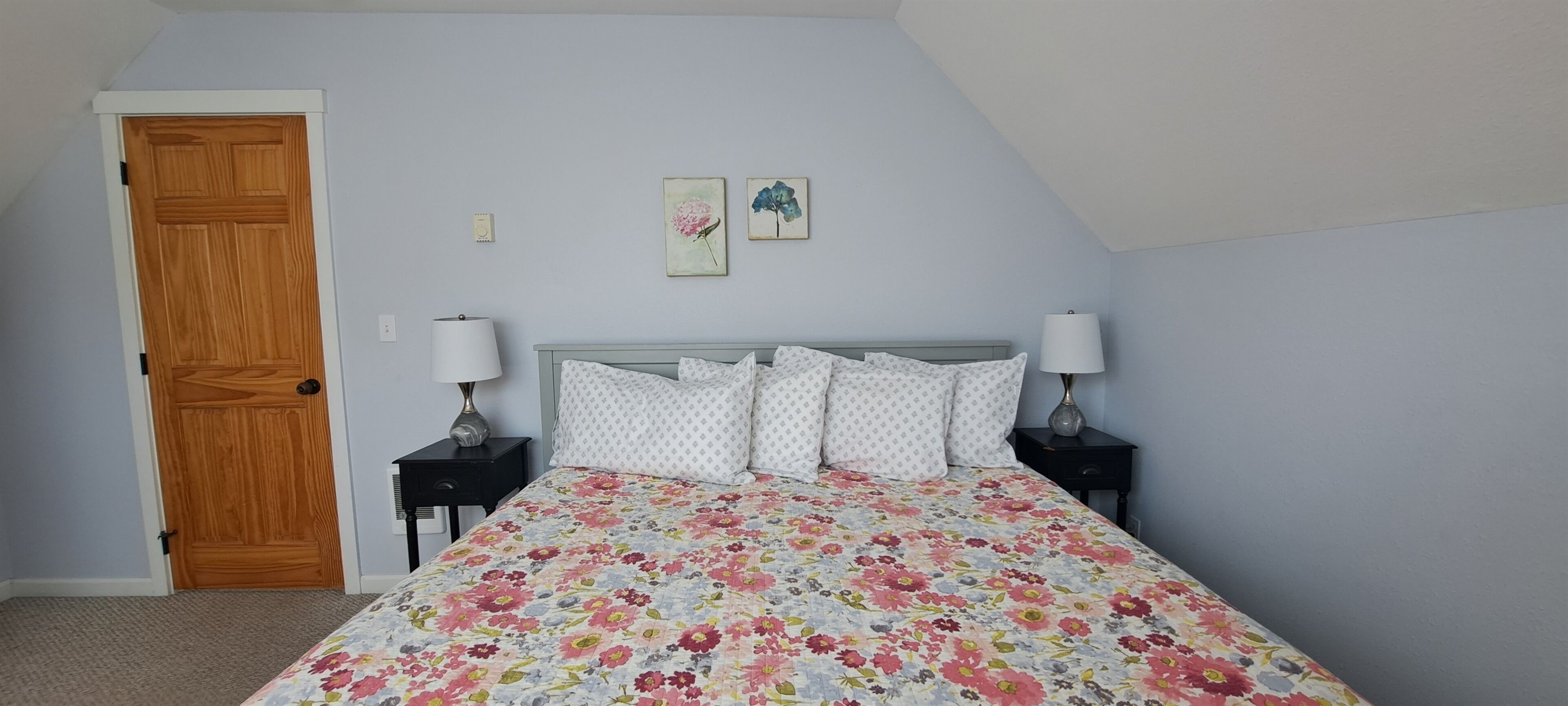 Soft pastel accents complete the king bedroom, offering a peaceful and inviting space to unwind after a day at the beach.