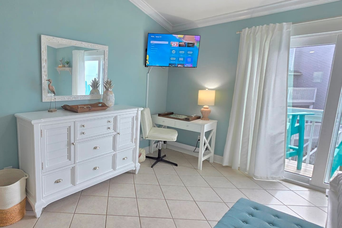 Open the laptop or close it entirely &mdash; the master suite work area looks out over Gulf views that make focusing optional on vacation.