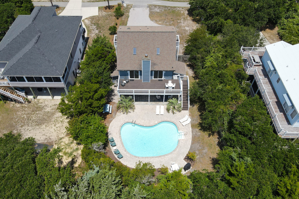 Bird&rsquo;s-eye view of the home, private pool, and outdoor living spaces