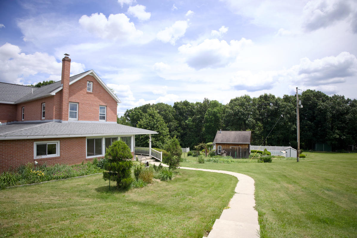 Walkway to covered porch, overlooking the pool area