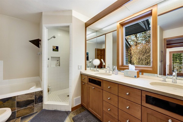 Master bathroom en suite, double shower heads, and access to the outdoor shower!