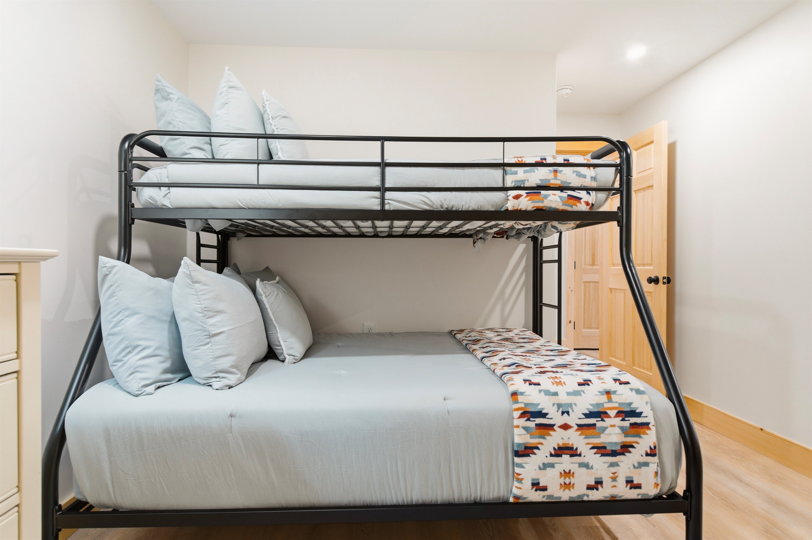 Flexible sleeping for everyone! Our sturdy bunks and bright decor make this room a guest favorite.