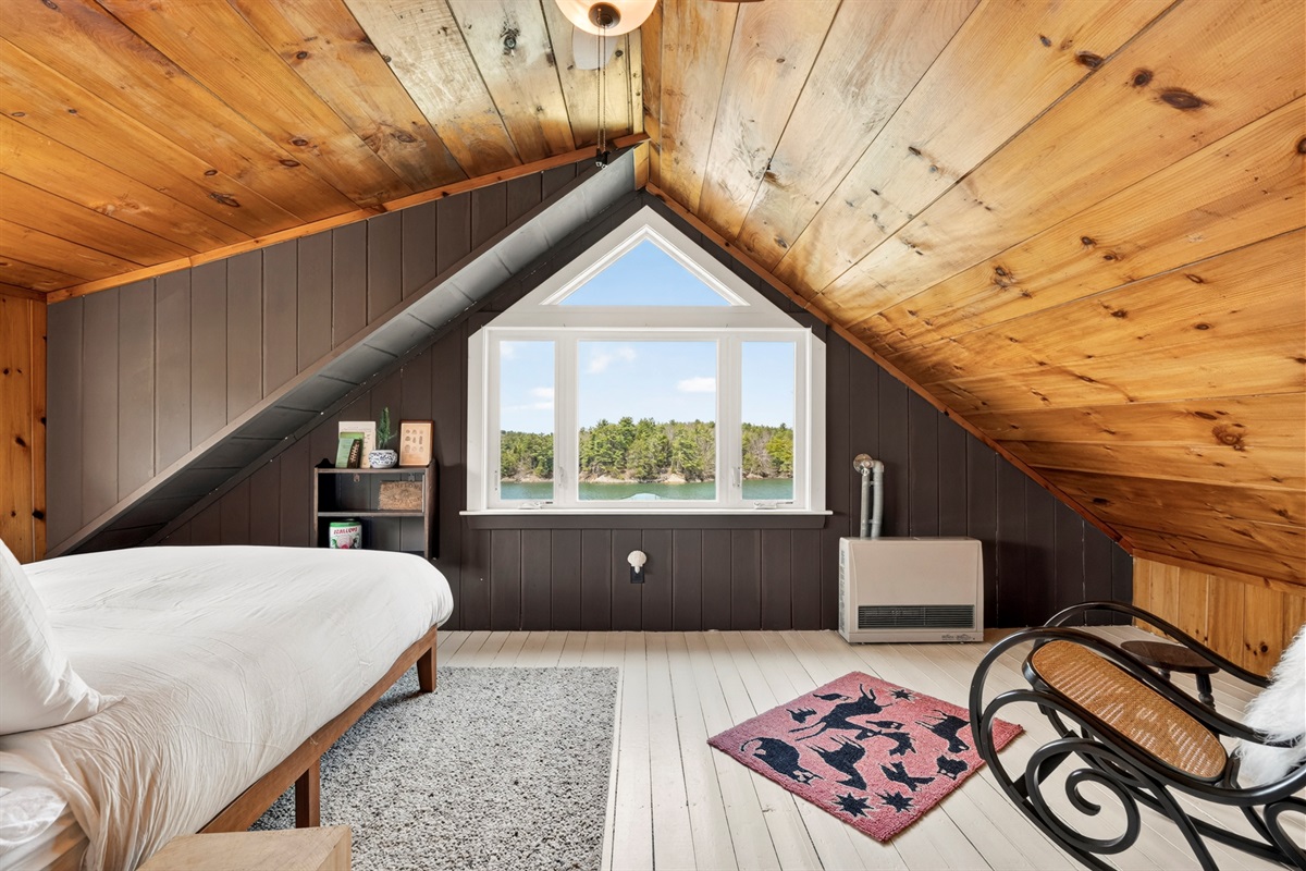 Primary bedroom with water view 