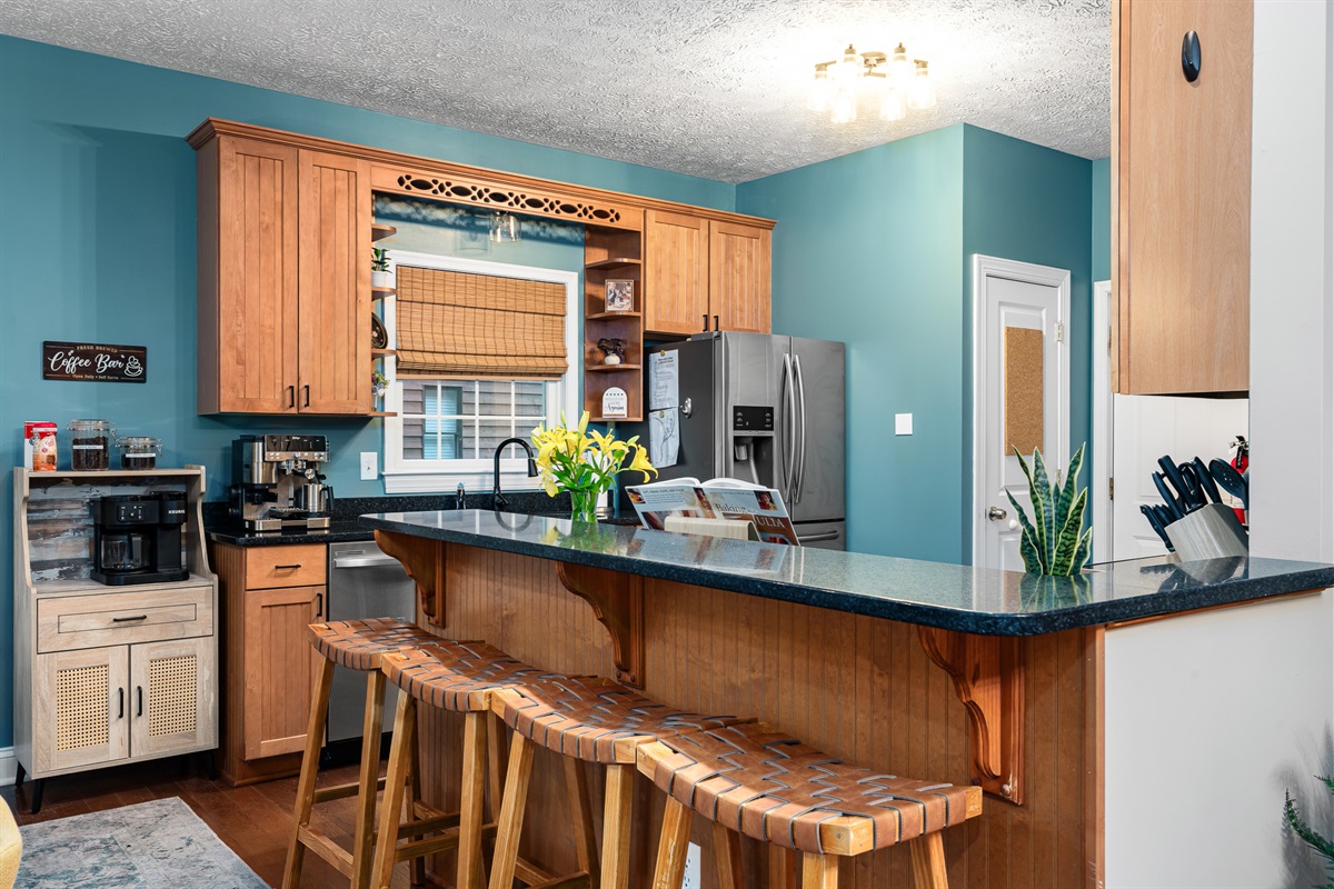 Pull up a seat at the breakfast bar — perfect for morning coffee, late-night snacks, or chatting while the chef of the group works their magic.