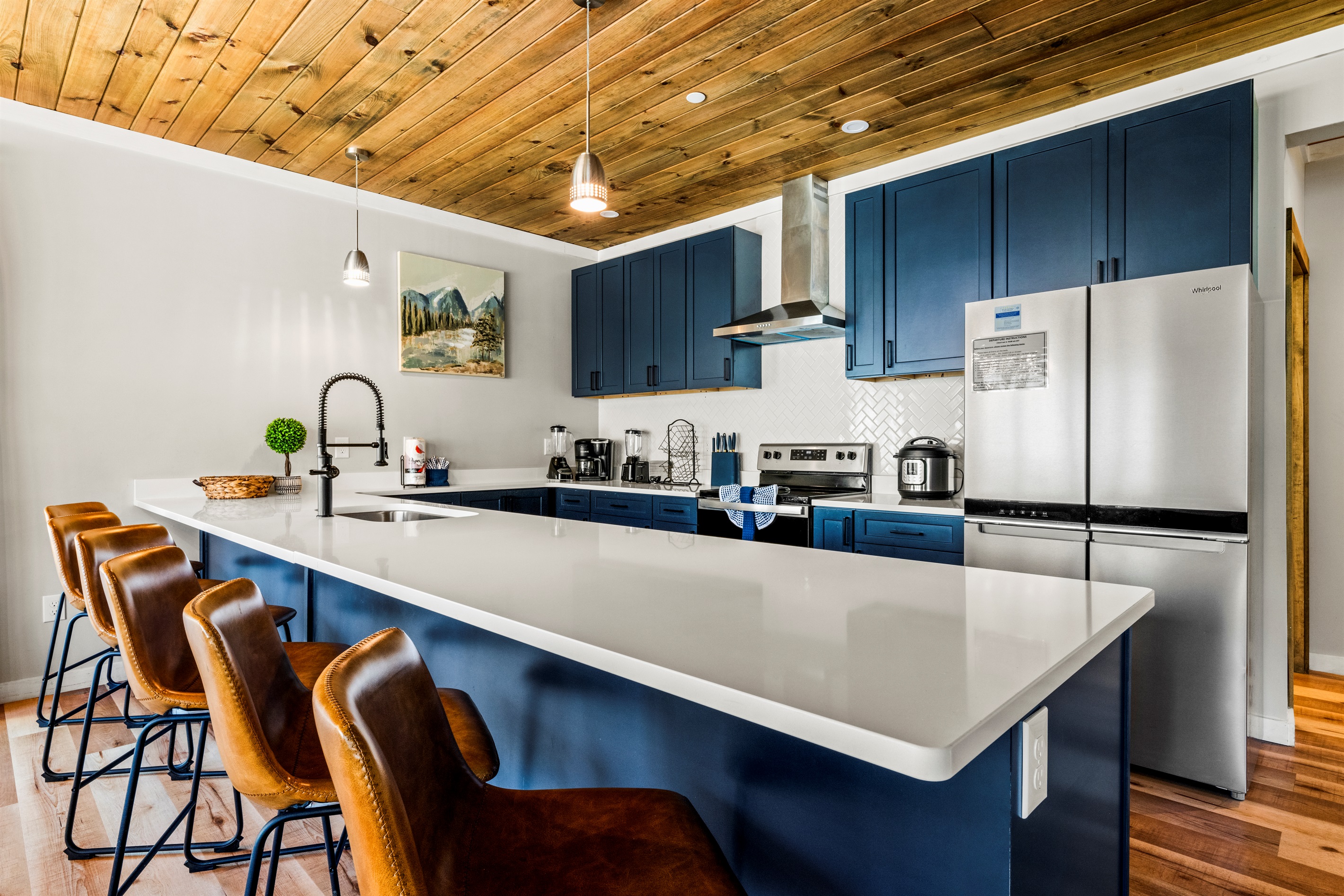 Enjoy a high-end culinary experience with a full suite of appliances, including a microwave, dishwasher, and stove with oven.