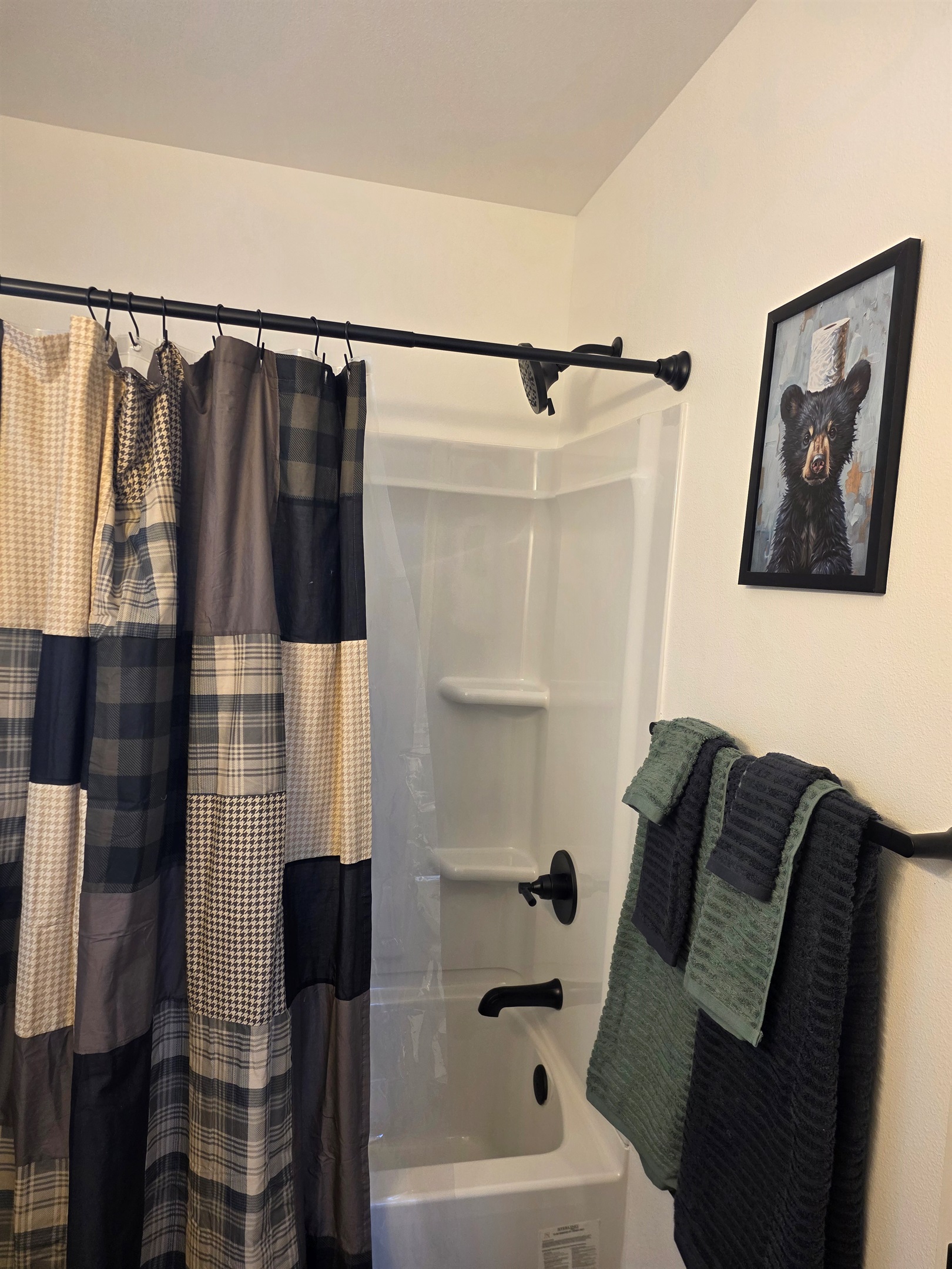 Bathroom includes a vanity, toilet, and shower/tub combo.