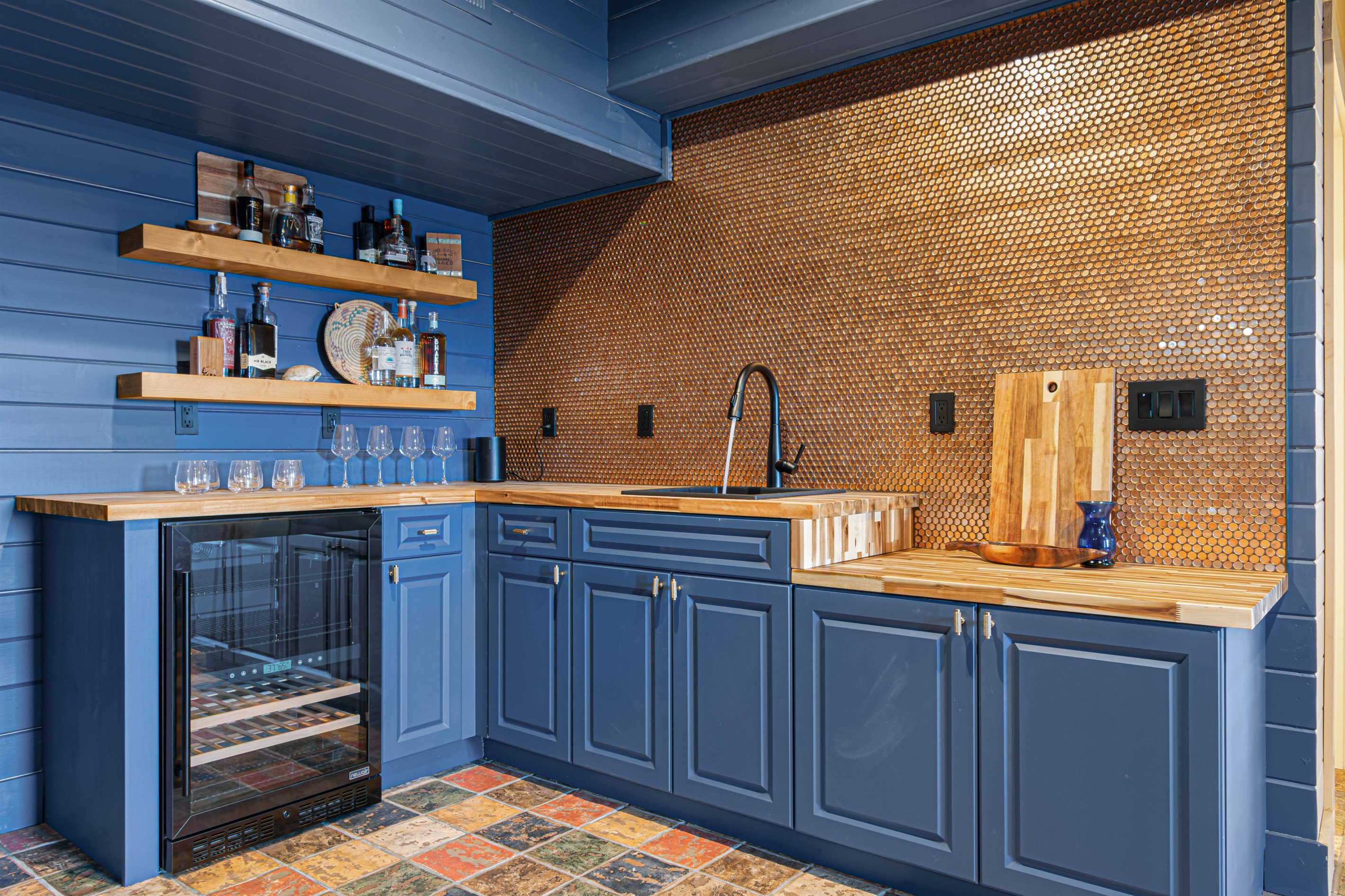 Downstairs Kitchenette: Stylish space with elegant wood finishes and a chic honeycomb backsplash!