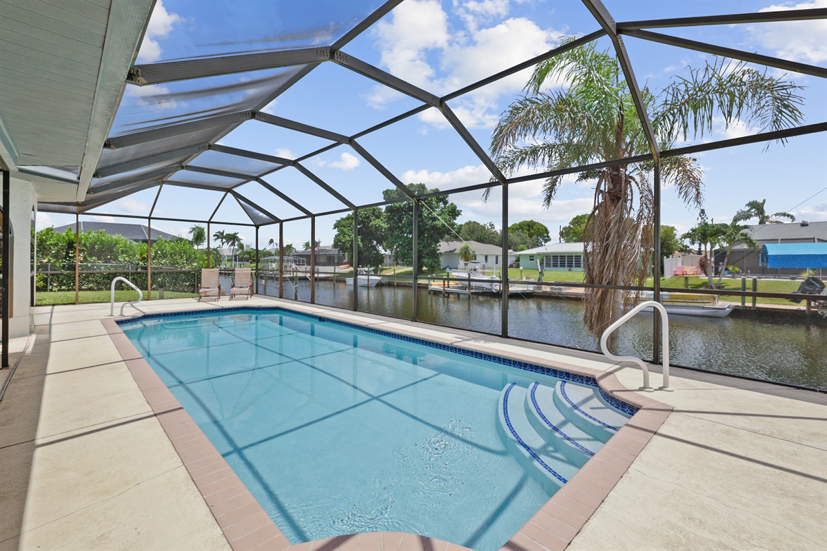 Heated pool with a canal backdrop