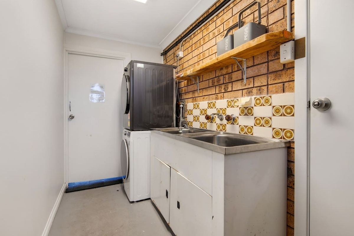 The laundry on the lower level, by the deck and games room, adds another practical detail to Skye’s Beach House for longer stays.
