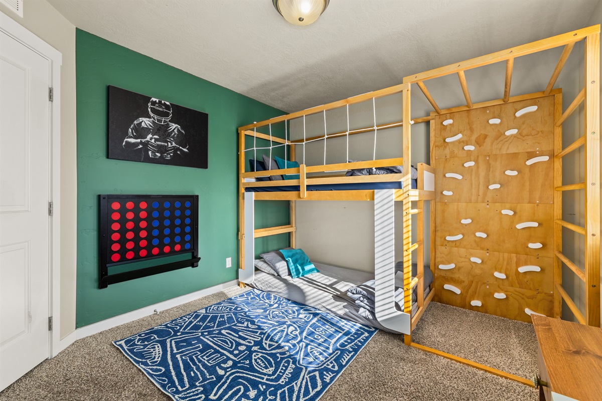 Your kids will beg to stay longer in this epic room complete with basketball games, connect 4, climbing and more!
