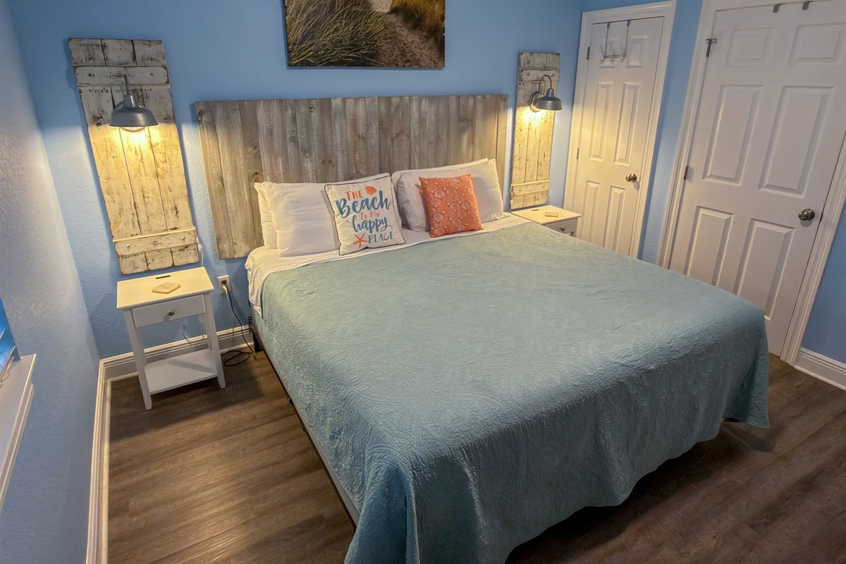 This inviting bedroom pairs calming blue hues with weathered wood accents for a serene, seaside-inspired escape.
