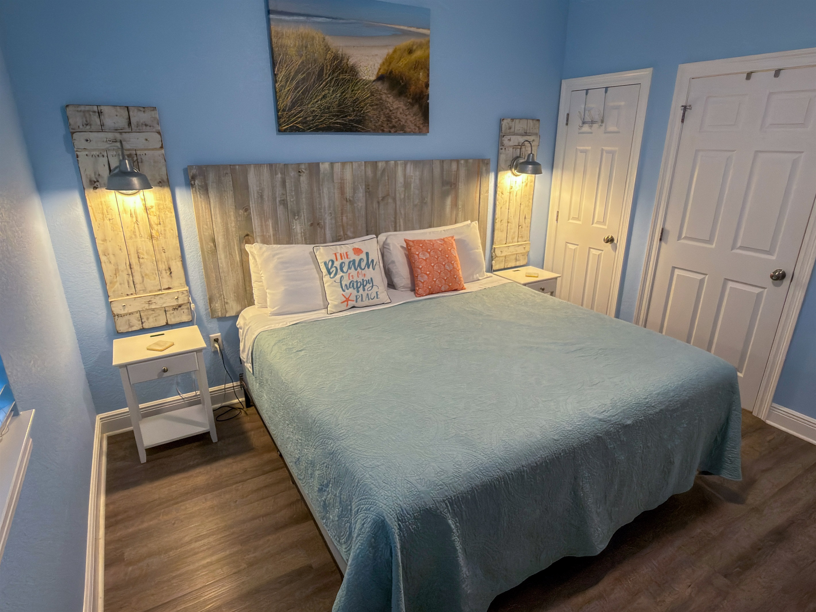 This inviting bedroom pairs calming blue hues with weathered wood accents for a serene, seaside-inspired escape.