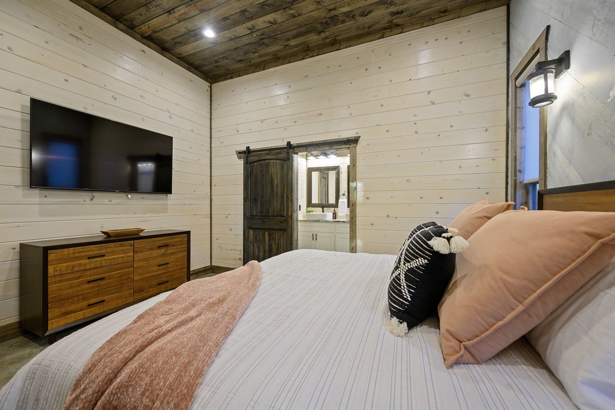 A cozy retreat wrapped in warm wood tones and soft lighting — unwind, recharge, and let the forest calm settle in.