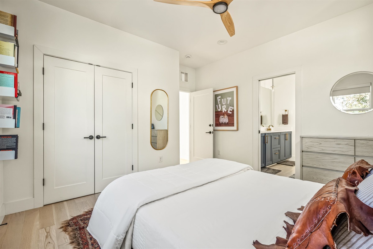 Inviting bedroom retreat with modern design, storage space, and ensuite access