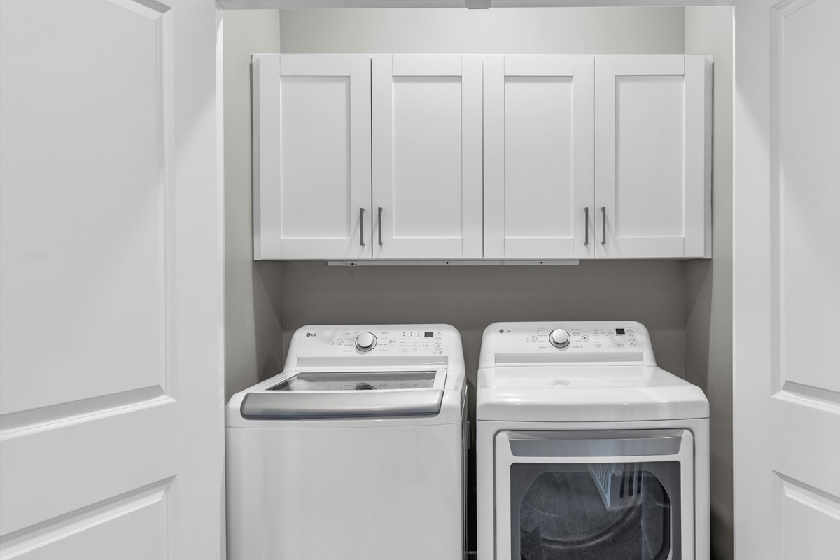 Upstairs Laundry Closet with Cabinet Storage