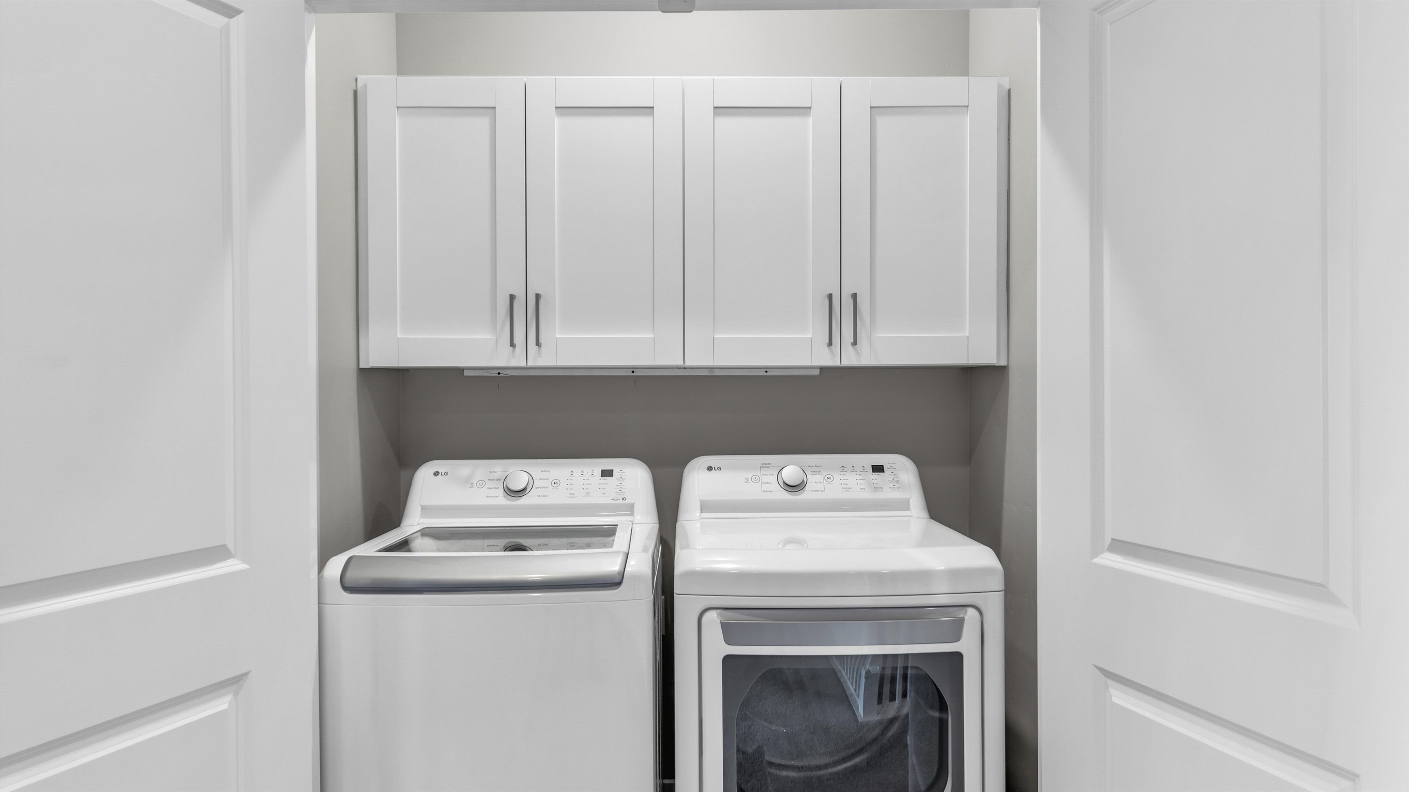 Upstairs Laundry Closet with Cabinet Storage