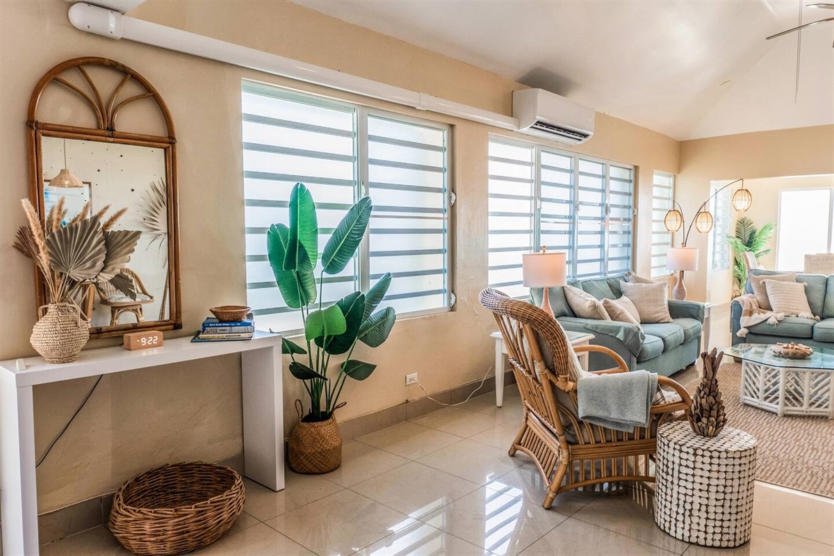 Stylish and inviting living room for relaxing moments. The living room has a split unit to help keep the common area cool. 