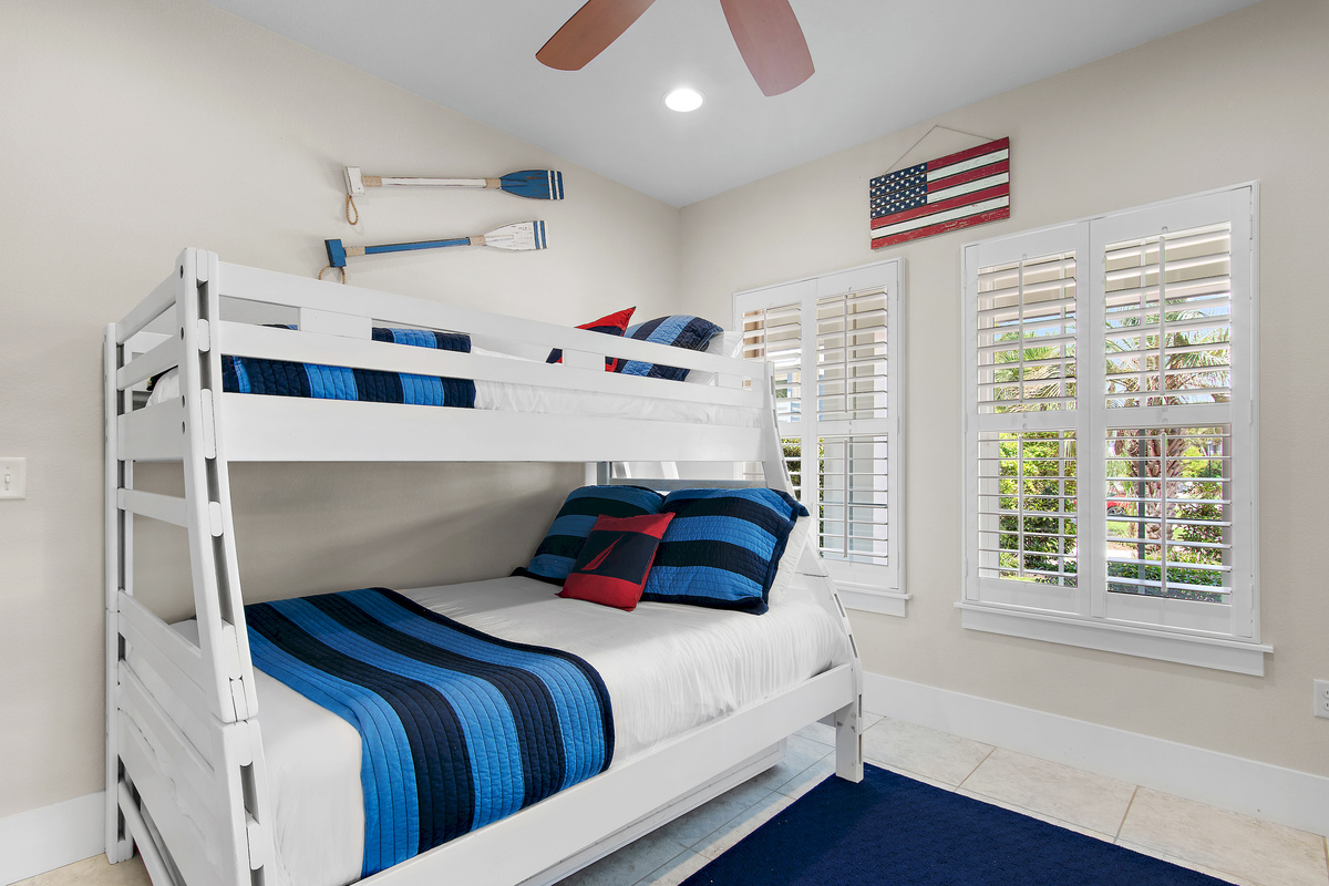 Bright and comfortable bunk room with fun coastal touches, perfect for kids or extra guests.

