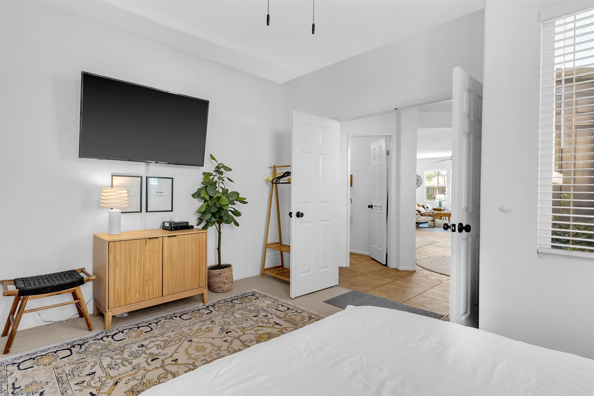 The guest suite includes a smart TV, an open layout, and a relaxing atmosphere designed for comfort