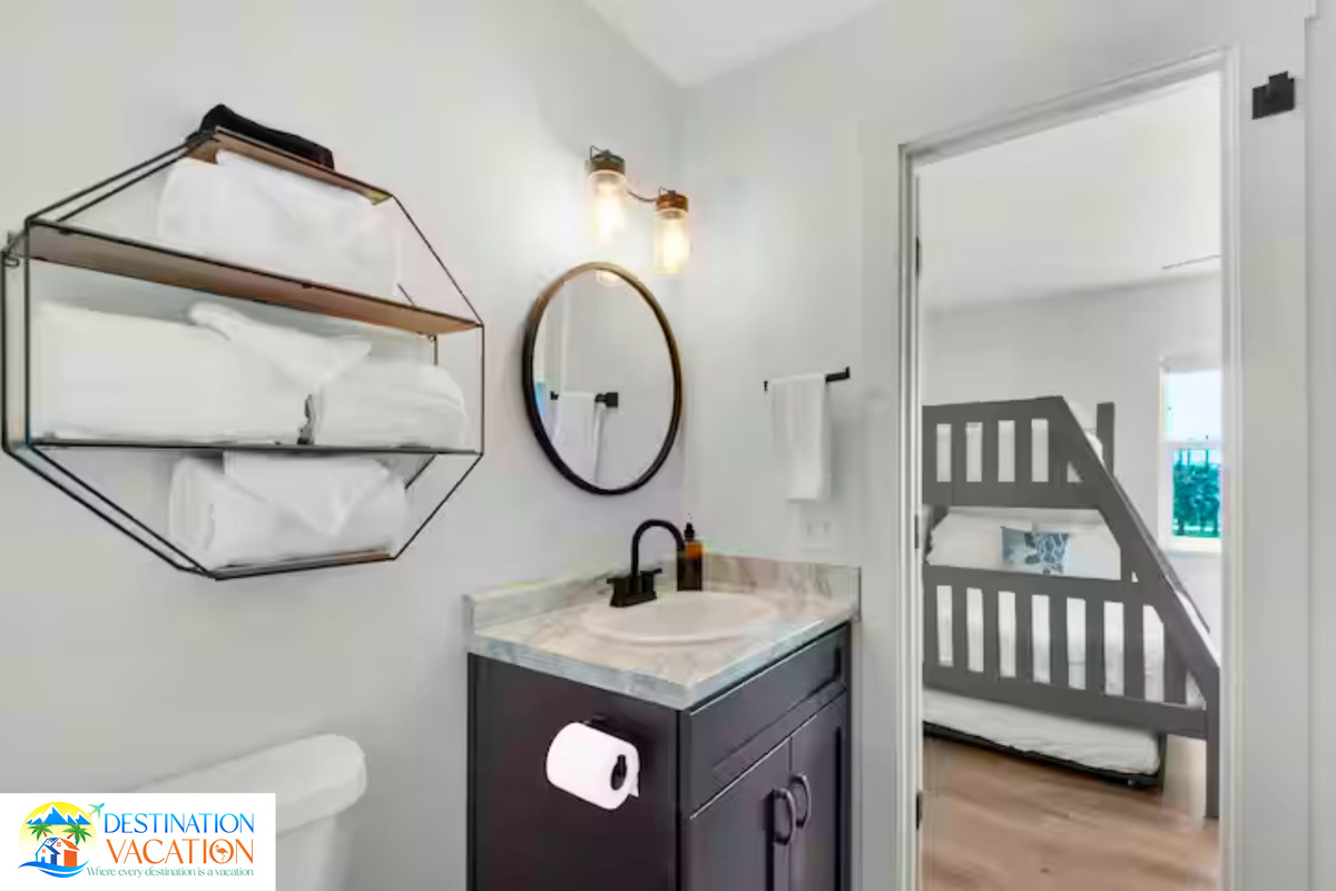 Bright bathroom combines coastal charm with thoughtful design.