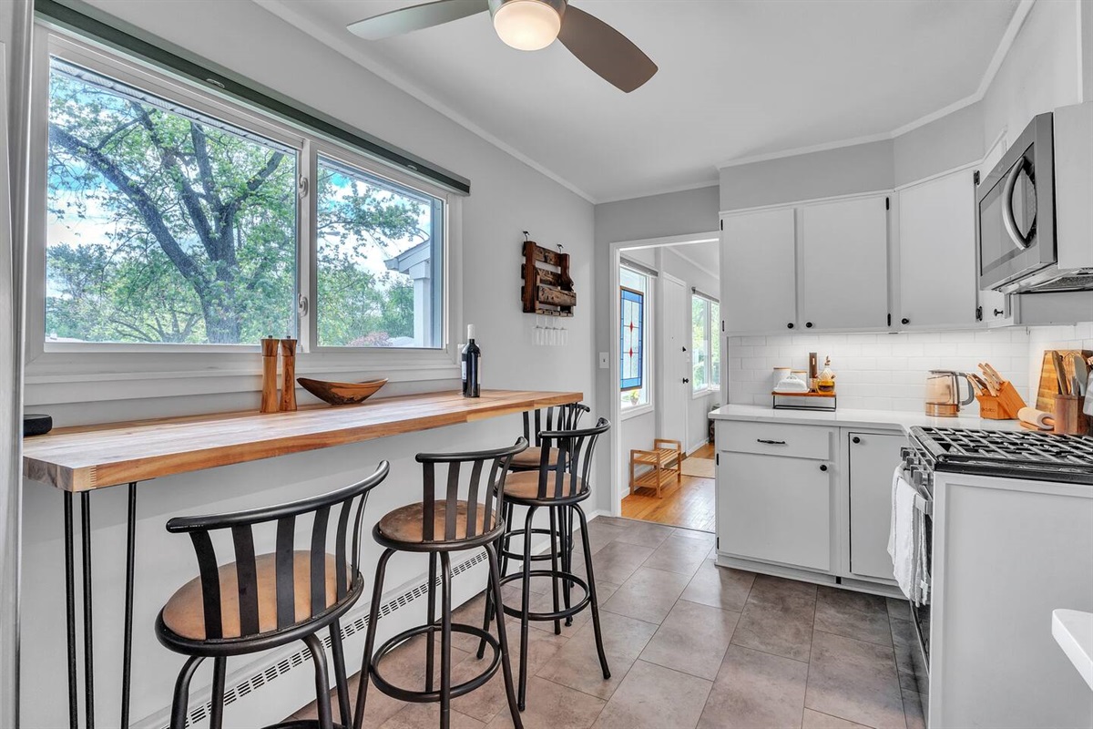 Have a glass of while at the kitchen bar