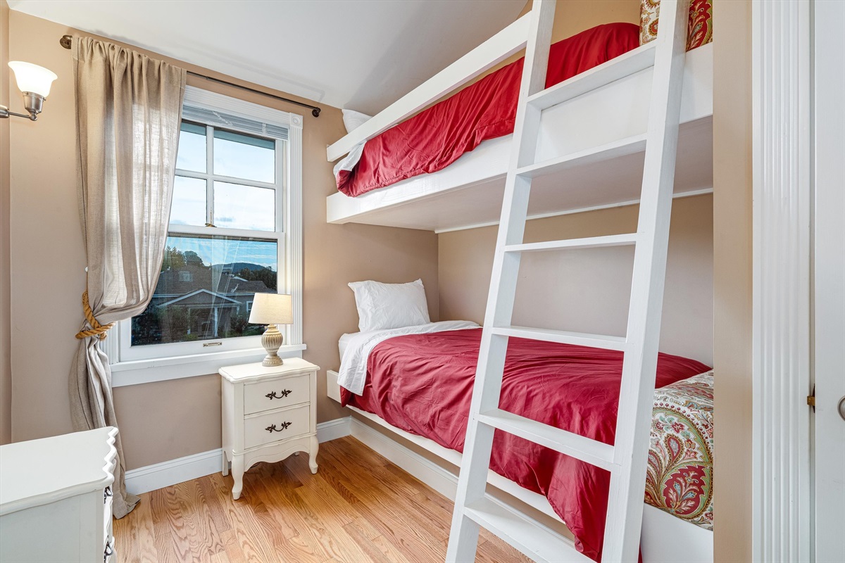 Bunk room with red oak flooring