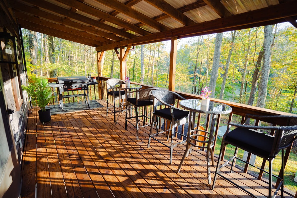 Enjoy the views from the covered, the perfect spot to sip your morning coffee.