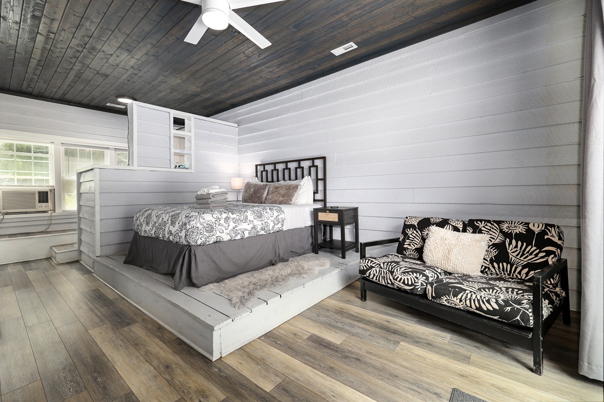 Bedroom 1 with Queen bed, access to deck and ensuite bathroom