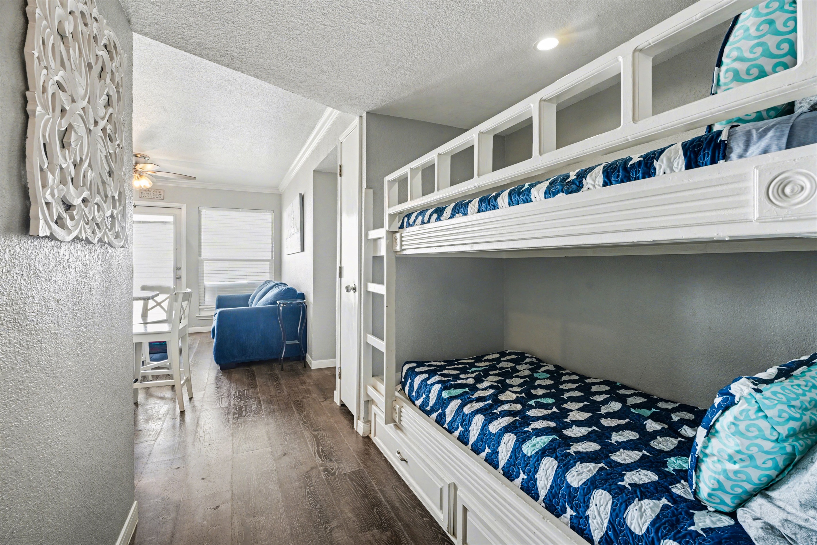 Bunk area with toys underneath in drawers