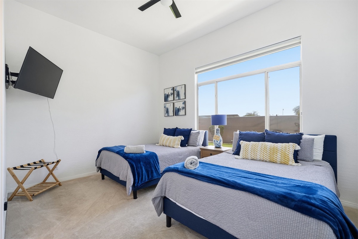 Bedroom two not only has two queen beds but a TV as well to unwind and the end of your day,