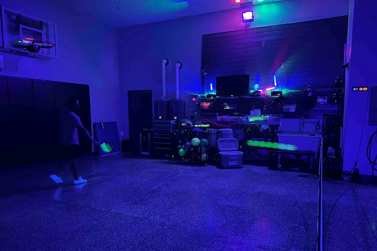 Glow in the dark pickleball court inside garage, we have the court lines as well.