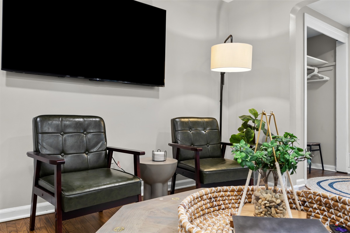 In our living room, you'll find adorable chairs that add a touch of charm.