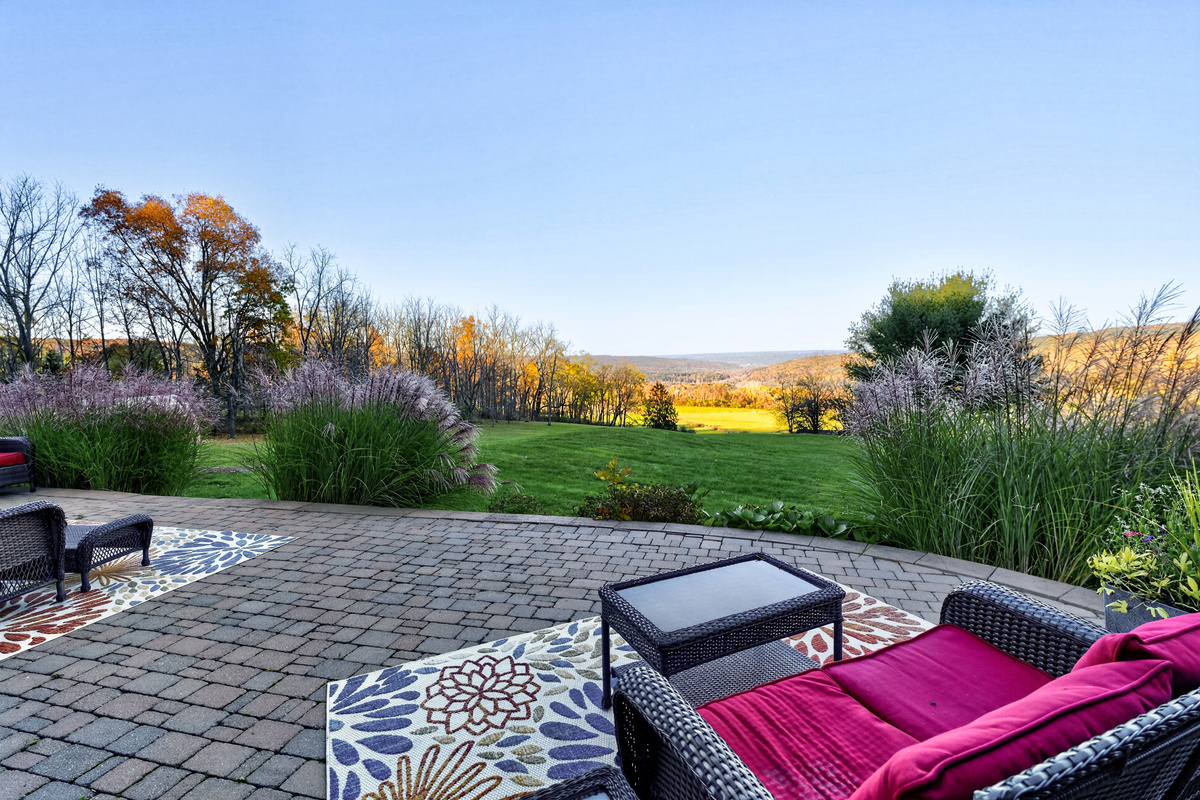 Patio lounge chairs overlooking the landscaped yard