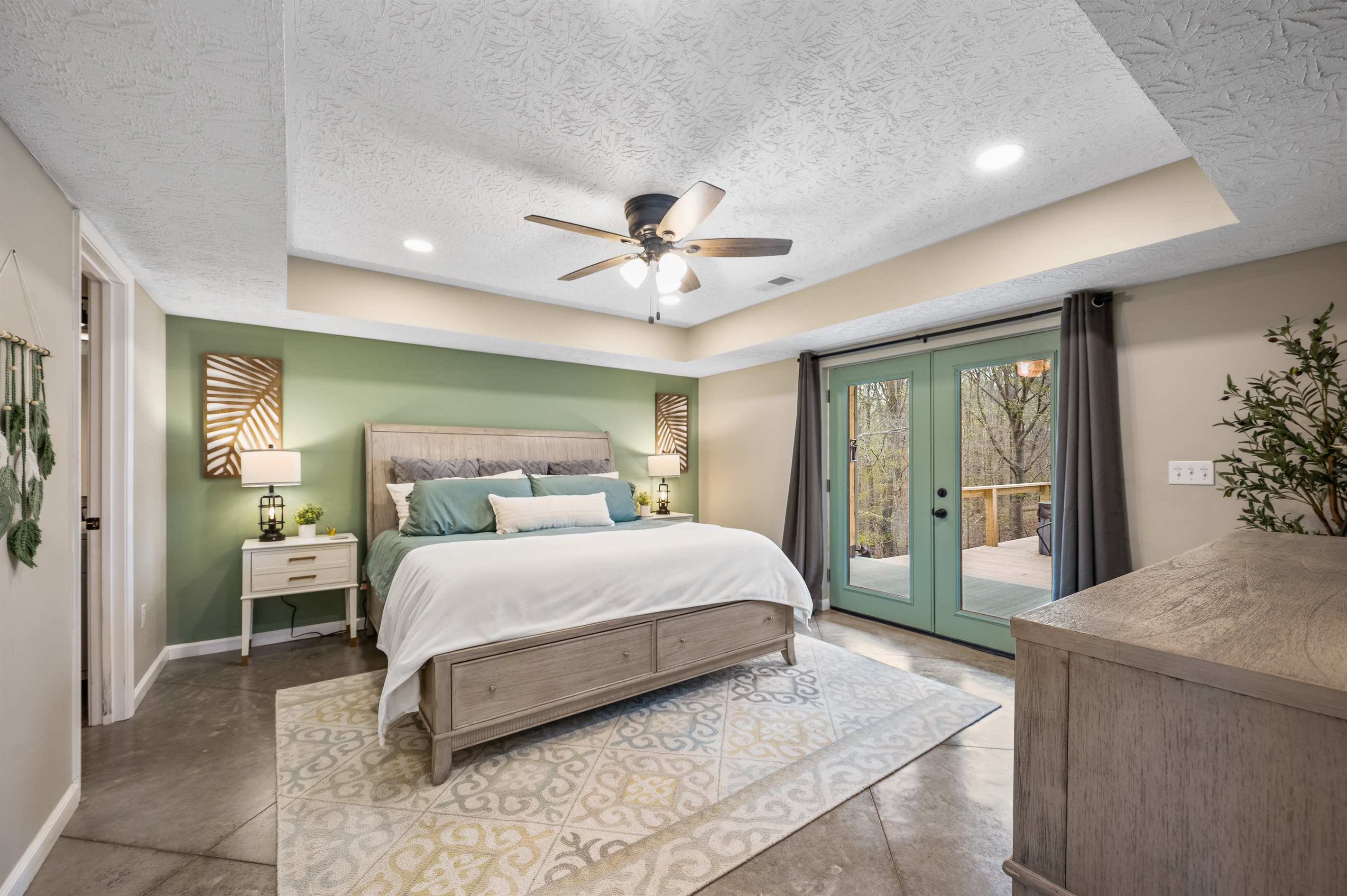 The first-floor master bedroom offers a king-sized bed, a full en suite bathroom, walk-in closet and French doors that lead out to the back patio—your private oasis.