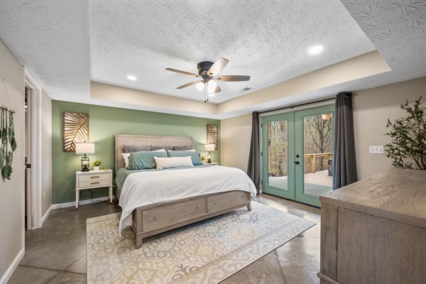 The first-floor master bedroom offers a king-sized bed, a full en suite bathroom, walk-in closet and French doors that lead out to the back patio—your private oasis.