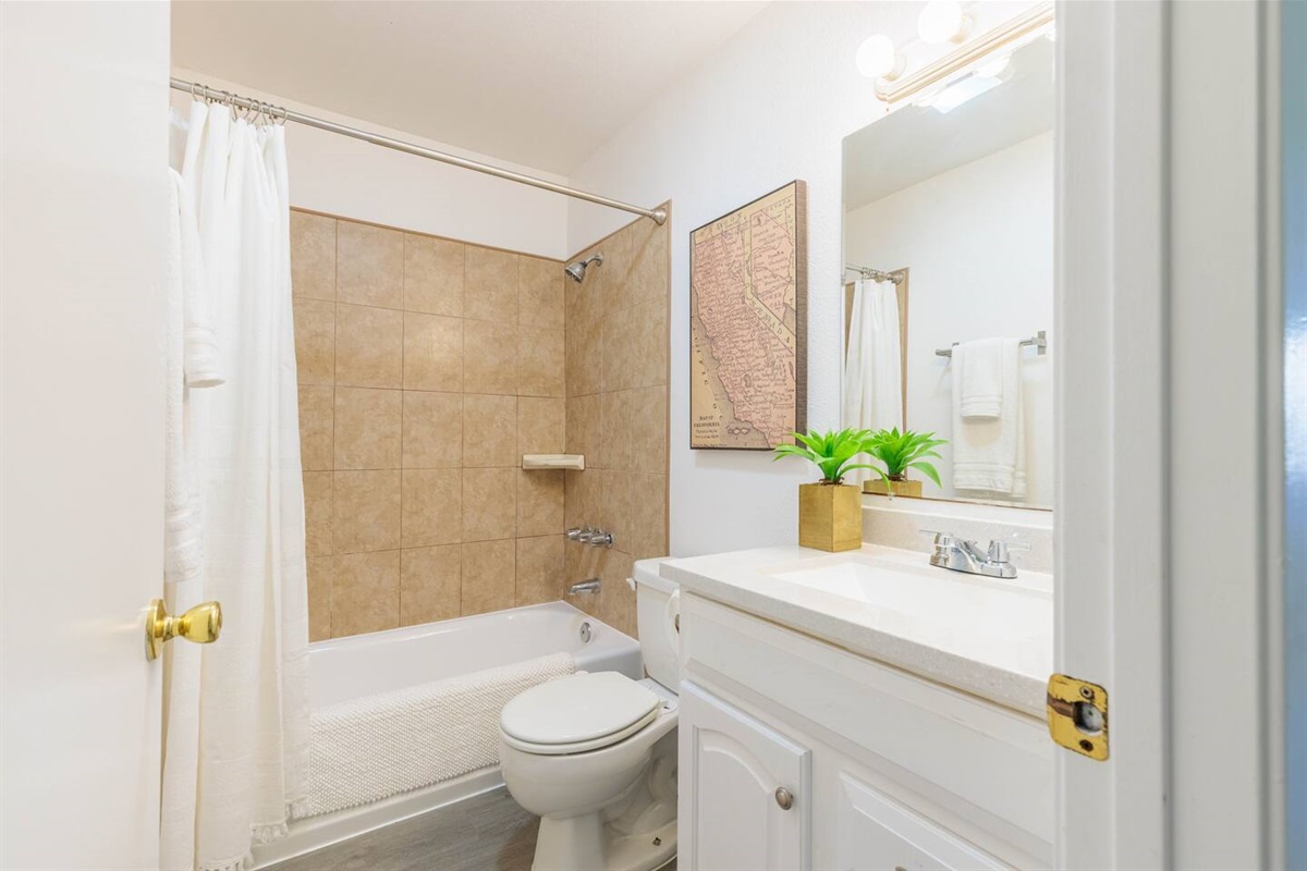 Fluffy stocked bathroom with fluffy towels.