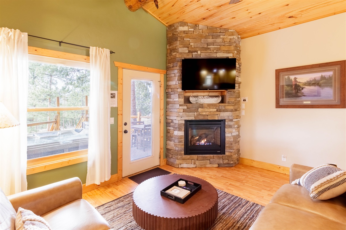 Family room features a gas fireplace and stunning mountain views
