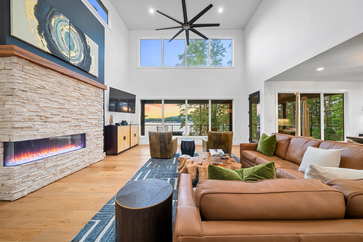 Warm tones, sleek design, and a stunning fireplace make this living space unforgettable.
