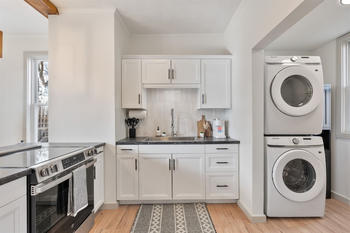 Fully remodeled kitchen with brand new clean laminate flooring, new appliances and over size sink.