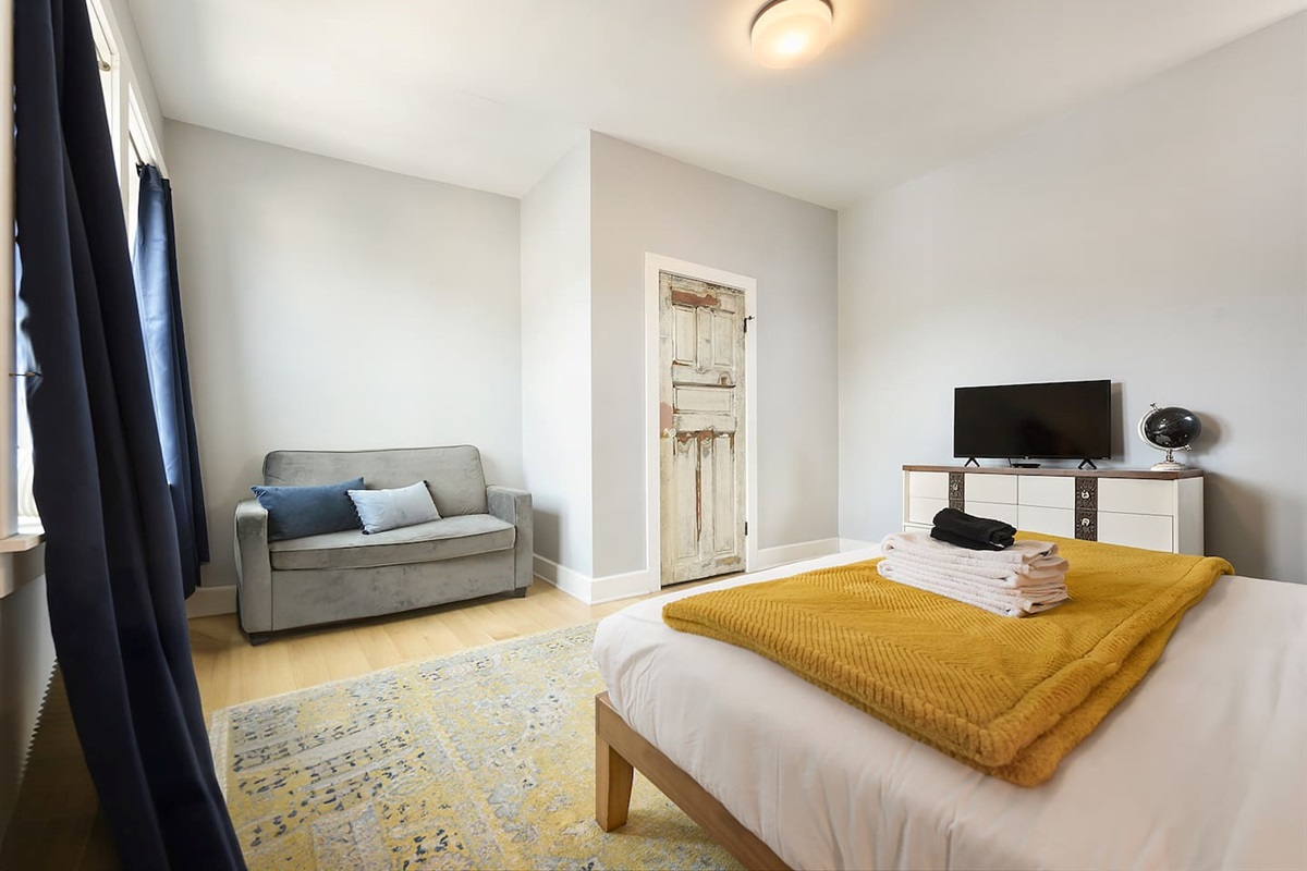 Spacious and elegant queen-sized bedroom with designed for comfort and style.