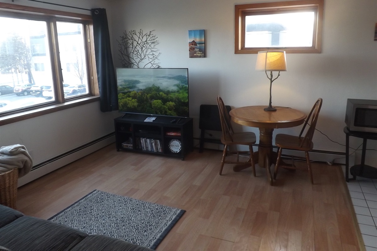 Reclining sofa with large Roku smart TV in living room